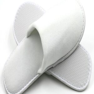 White disposable hotel slippers