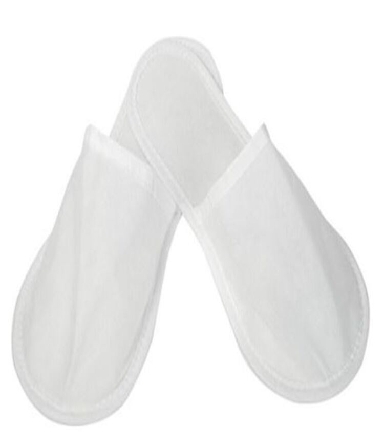 Standard white non-woven disposable hotel slippers supplied by Korsev Trading